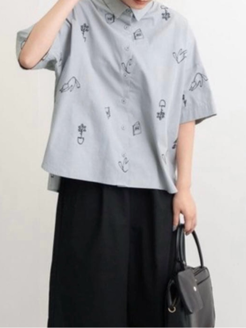 Pou Dou Dou Cats, Plants, and Books Grey Shirt with Minimalist Black Motifs